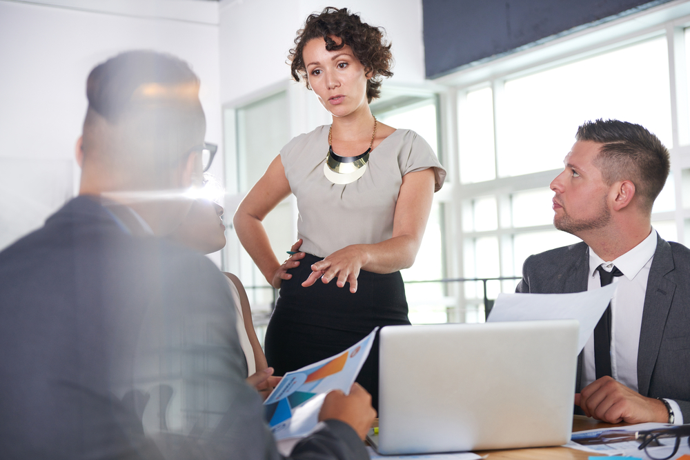 team of successful business people having a meeting in executive sunlit office team of successful business people having a meeting in executive sunlit office